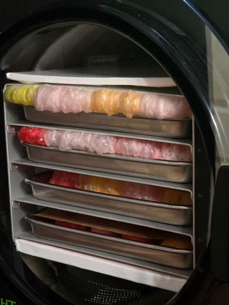 a shot of our freeze dryer with starburst slowly exploding out from between the trays