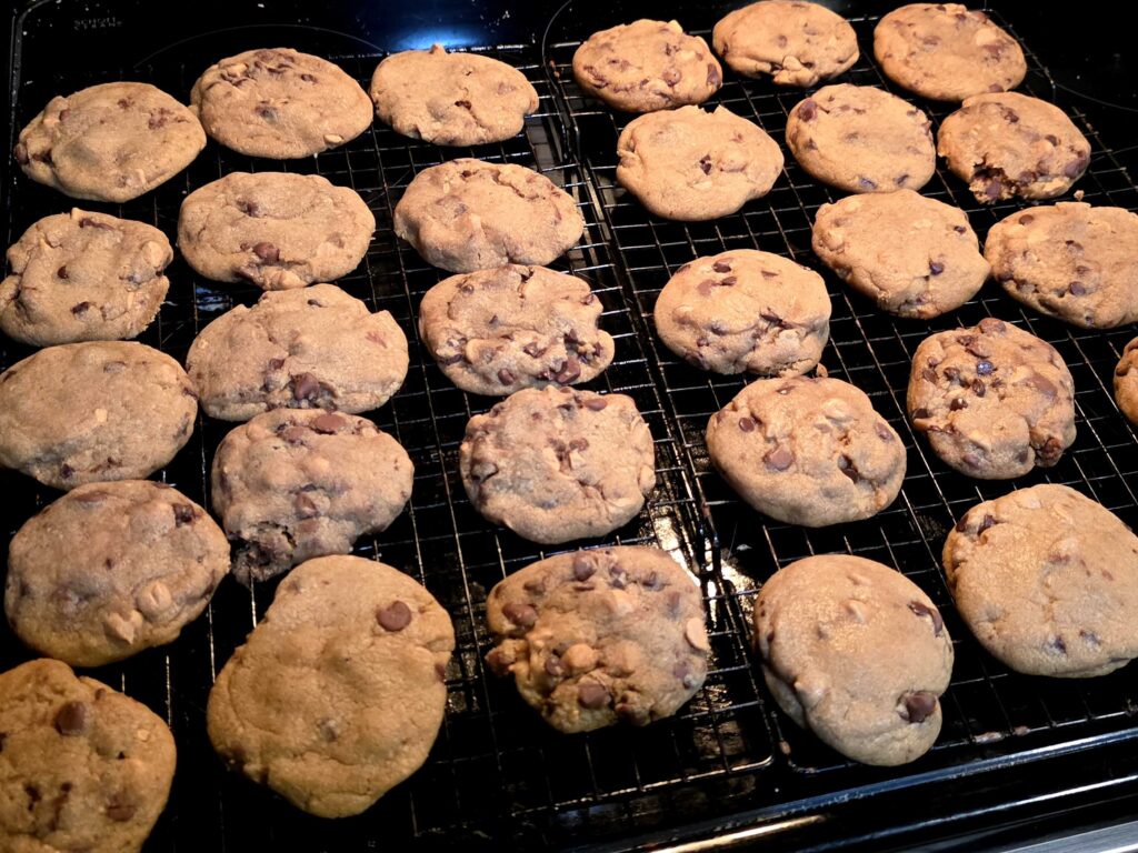 Two cooling racks full of delicious cookies.