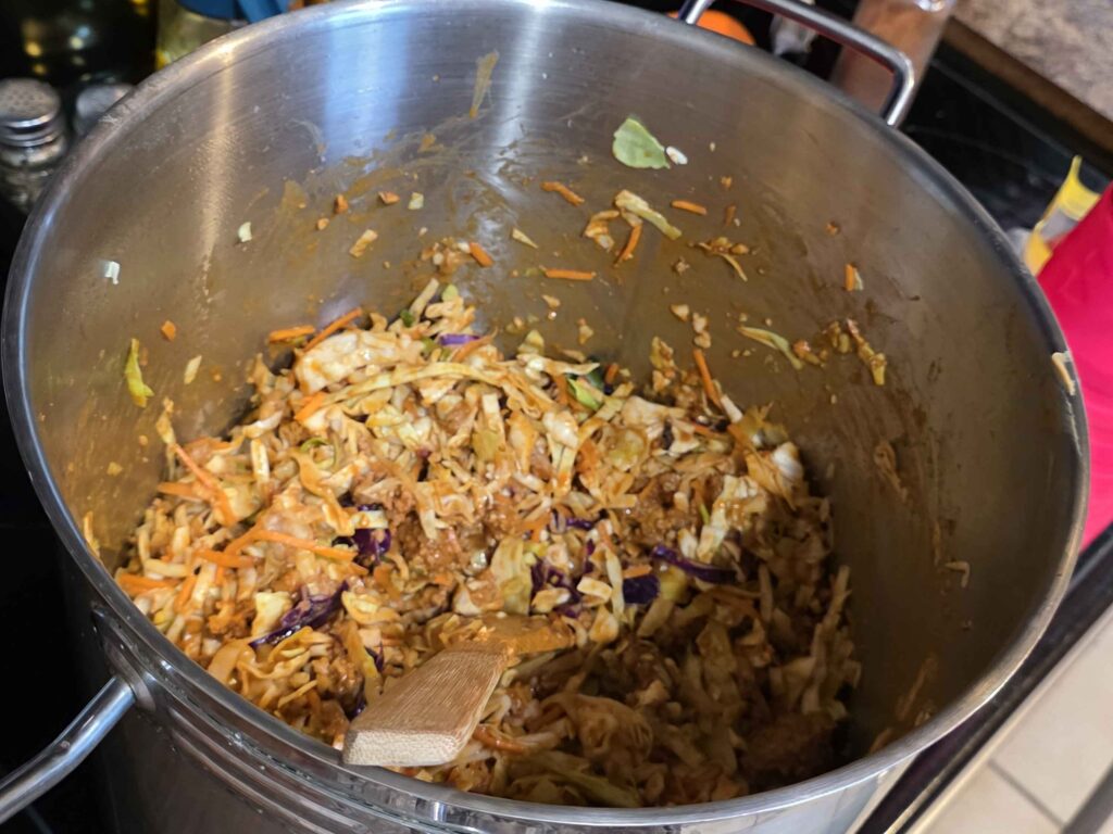 A giant pot of on the stove with all of the pork and cabbage and seasoning! I wish you could smell this.