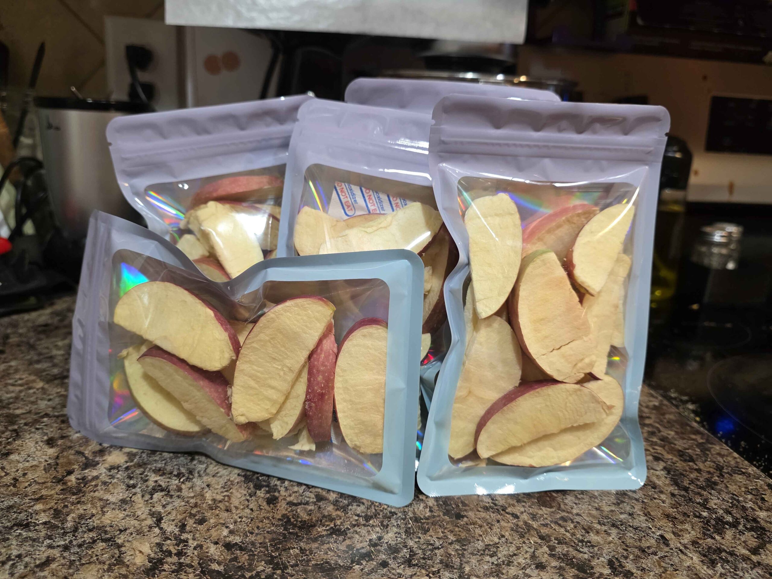 A stack of pretty mylar bags with transparent fronts. You can see that each has about 13 slices of dried apple--which is about one apple.