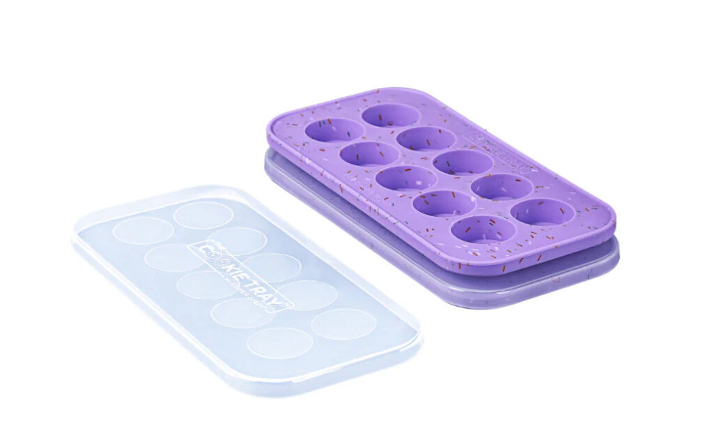 The Souper Cube cookie trays, which are basically two little trays that have 10 cavities each, perfectly sized to make one cookie's worth of frozen dough in a perfect cylinder.