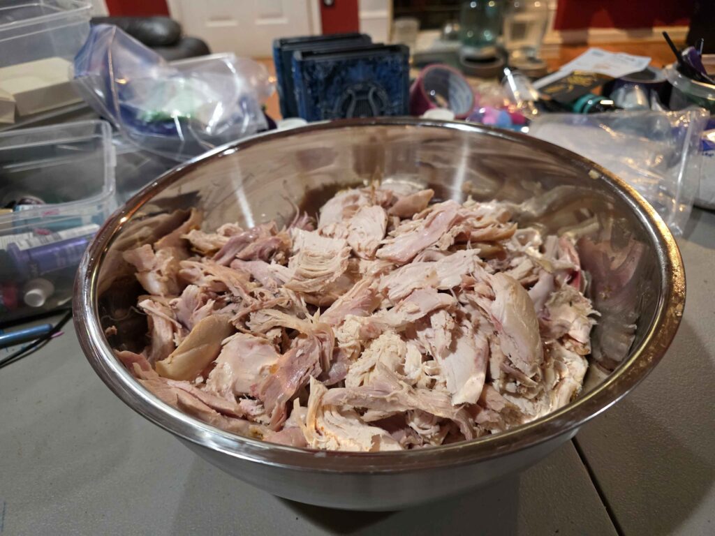 A giant bowl full of the meat I've pulled from 3 different chickens