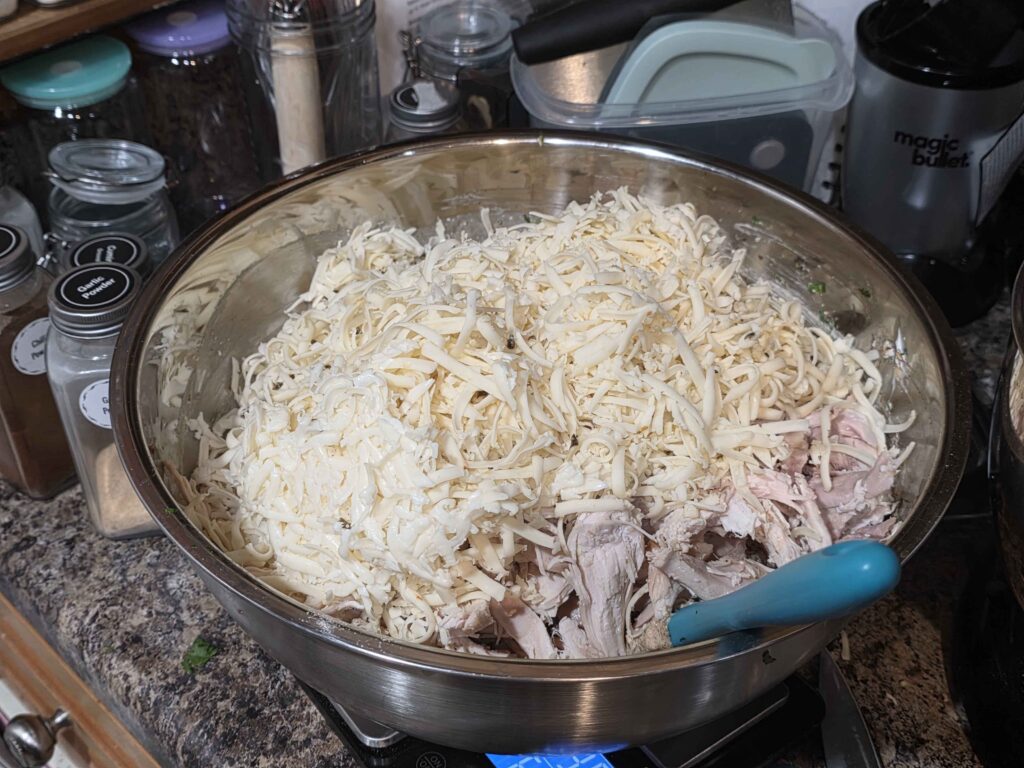 the same giant bowl now OVERFLOWING with all of the ingredients and shredded cheese, and it is clearly going to be hard to stir. (it was)
